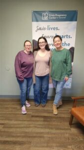 Three ladies representing for the Morgan Rizzo Mem donation