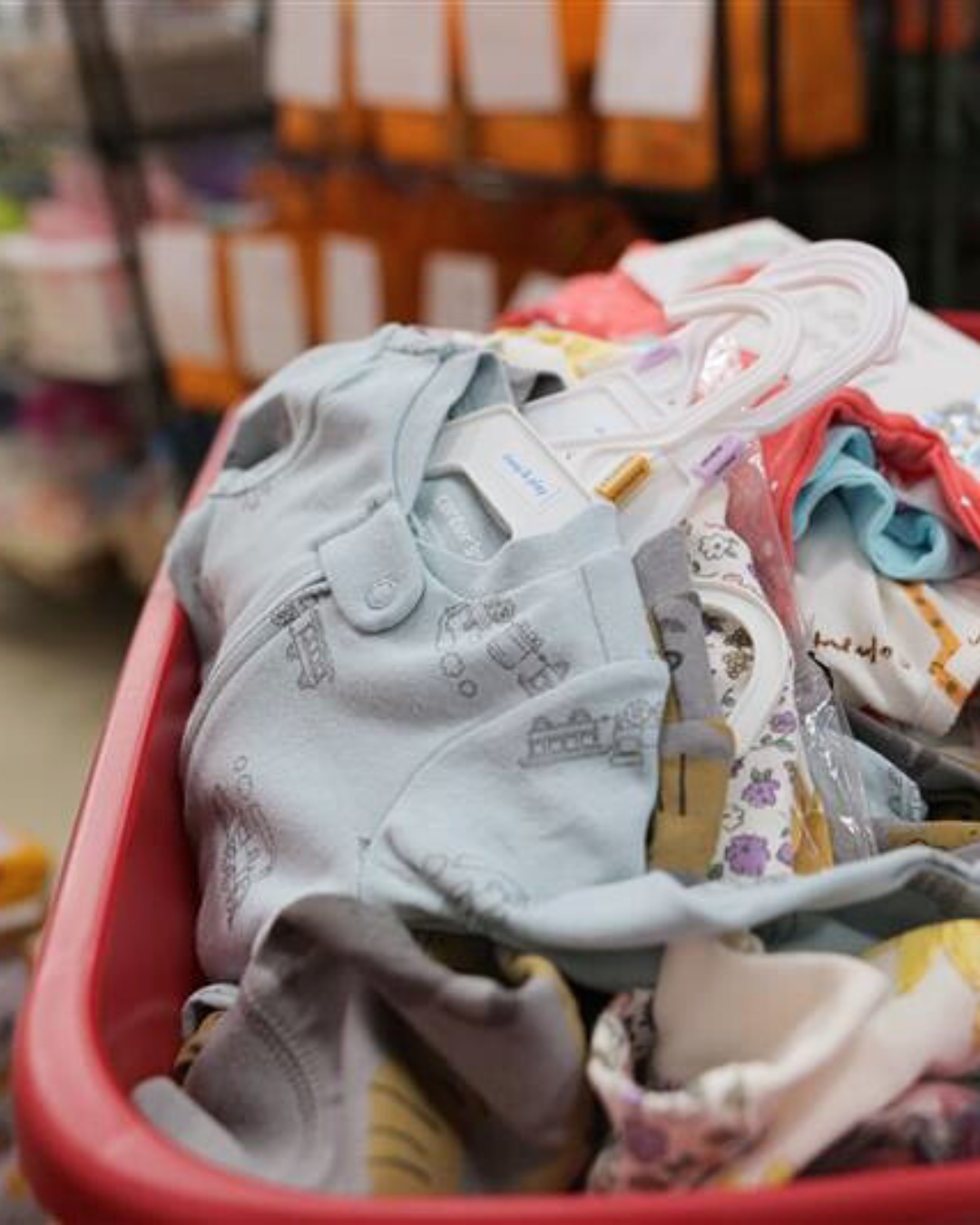 baby clothes piled together