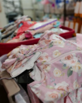 baby clothes in a pile