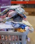 baby clothes in a basket